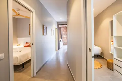 a hallway leading to a bedroom with a bed at 43MAL1000-Nice&Bright 2BR flat next to Sagrada Familia in Barcelona