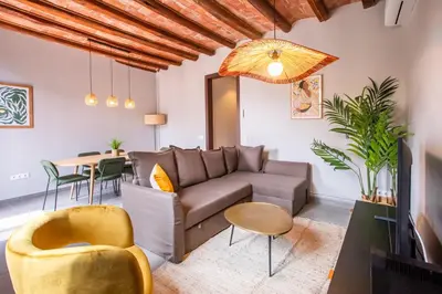 a living room with a couch and a table at 43MAL1000-Nice&Bright 2BR flat next to Sagrada Familia in Barcelona