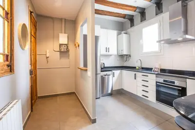 a kitchen with white cabinets and a window at 43MAL1000-Nice&Bright 2BR flat next to Sagrada Familia in Barcelona