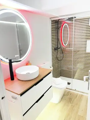 a bathroom with a sink and a mirror at Loft en Gracia in Barcelona