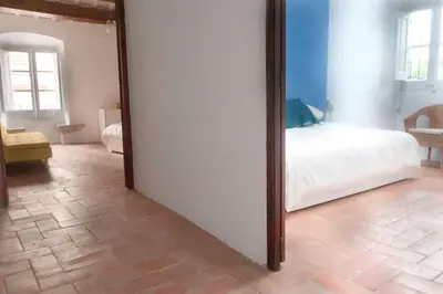 a large mirror in a room with a bed at Charming house in Sant Pol facing the sea in San Pol de Mar