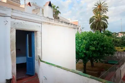 a mirror on a wall with a table in a room at Charming house in Sant Pol facing the sea in San Pol de Mar