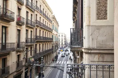 a view of a city street with buildings and cars at AinB Gothic-Jaume I Apartments in Barcelona