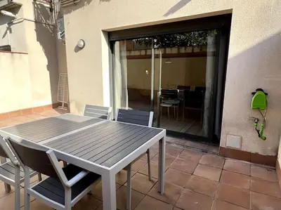 a table and chairs sitting on a patio at Apartamento entero con patio en Terrassa, Barcelona in Terrassa
