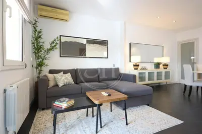 a white room with a closet and a mirror at Bonito apartamento con terraza in Barcelona