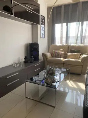 a living room with a couch and a coffee table at Piso cómodo Habitación in Sabadell