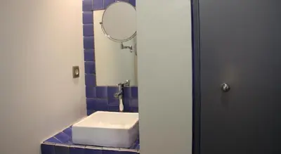a bathroom with a white sink and a mirror at Hotel Can Carol in Capellades