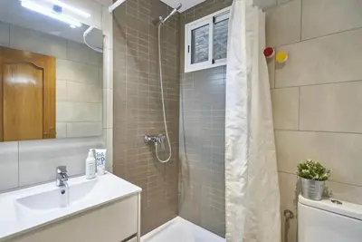 a hallway with a door leading to a room at BeBarceloner Sants Apartments- 3 bedroom in Barcelona