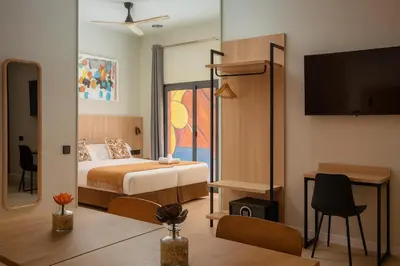 a hotel room with a bed and a tv at Aerohotel Barcelona Airport 24h in El Prat de Llobregat