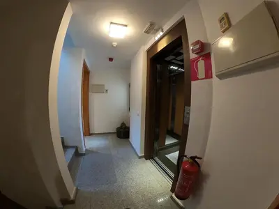 a hallway with a fire hydrant in a building at Sitges rooms by Sitges Apartment in Sitges