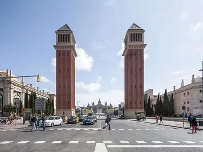two tall towers on a city street with a crosswalk at Apartment in Barcelona near Seabeach in Barcelona