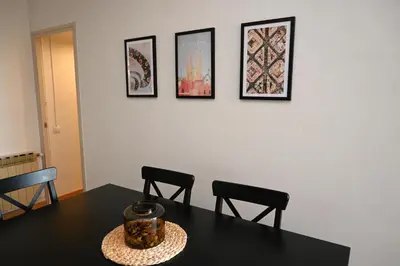 a dining room with a table and two chairs at Homenfun Barcelona Alfonso X in Barcelona