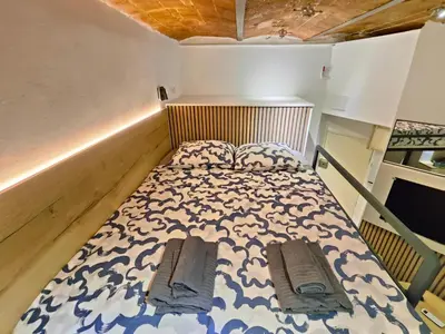 a small bedroom with a bed in a room at Moderno estudio Sagrada Familia in Barcelona