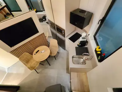an overhead view of a tiny house with a table and chairs at Moderno estudio Sagrada Familia in Barcelona