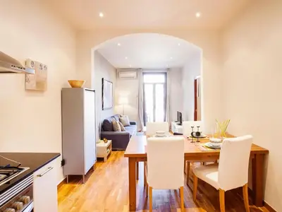 a kitchen and dining room with a table and chairs at Premium apartment in Barcelona in Barcelona