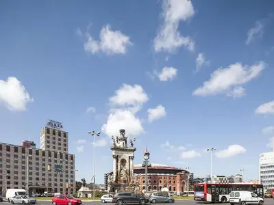 a city with a statue in the middle of a street at Premium apartment in Barcelona in Barcelona