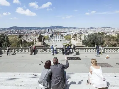 a man and two women taking a picture of a city at Apartment in Barcelona near the Beach in Barcelona