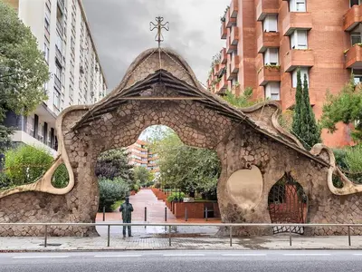 a man standing in front of a stone archway at Apartment in Barcelona near the Beach in Barcelona