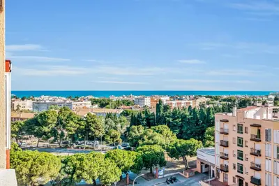 an aerial view of a city with trees and buildings at Sea View Penthouse in Vilanova i la Geltrú