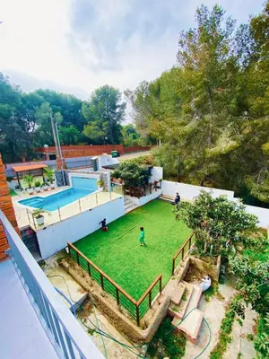 an aerial view of a yard with a pool at Vila Peña Private Apartment with Shared Pool & Gardens in Cubelles