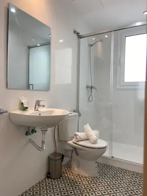 a bathroom with a sink and a toilet and a shower at RIUS33 - Huge & Spacious Apartment in Montjuic in Barcelona