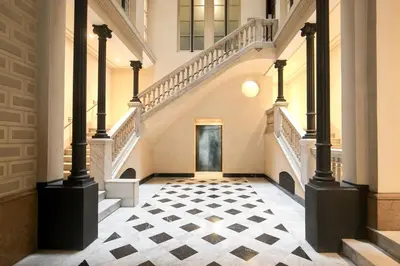an empty hallway with stairs and a door at Ático con terraza en el corazón de Barcelona in Barcelona
