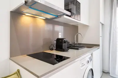 a kitchen with a sink and a stove at Fira Building in Hospitalet de Llobregat