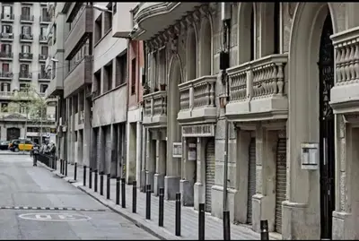a row of buildings on the side of a street at Stylish apartment in Plaça Espanya in Barcelona