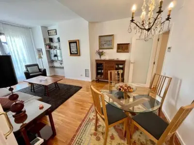 a dining room and living room with a glass table at Apartamento con 2 Dormitorios, Elegante y Céntrico en Rambla Catalunya - ES-341-2 in Barcelona
