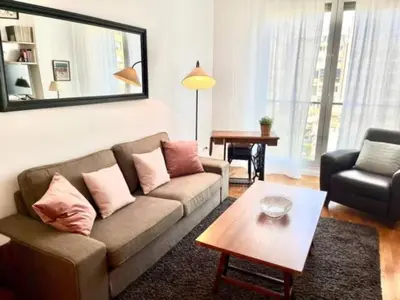 a living room with a couch and a table at Apartamento con 2 Dormitorios, Elegante y Céntrico en Rambla Catalunya - ES-341-2 in Barcelona