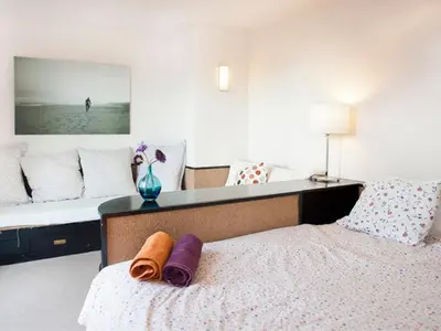 a bedroom with a bed with two towels on it at Apartamento con terraza privada y Wifi en el corazón de Barcelona - ES-341-5 in Barcelona