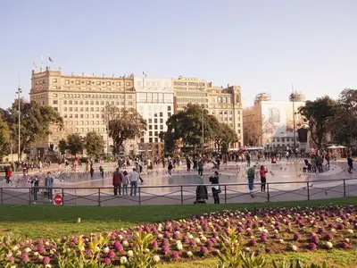 a group of people walking around a fountain in a city at Apartamento con terraza privada y Wifi en el corazón de Barcelona - ES-341-5 in Barcelona