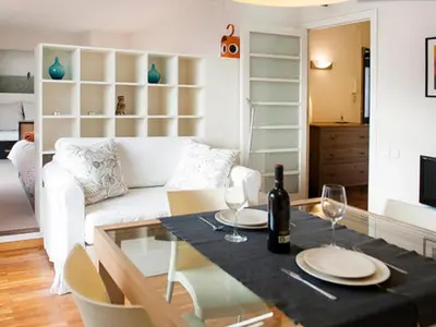 a living room with a dining table and a couch at Apartamento con terraza privada y Wifi en el corazón de Barcelona - ES-341-5 in Barcelona