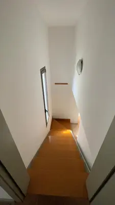 a staircase with a window in a white room at SE Céntrico con Terraza in Terrassa