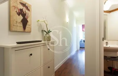 a bathroom with a sink and a vase on a counter at Bonito apartamento 3 in Barcelona