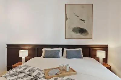 a white kitchen with white cabinets and a sink at Eboli - 3 bedrooms, balcony and terrace in Ciutat Vella in Barcelona