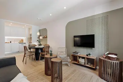 a bed with two mugs and a tray on it at Eboli - 3 bedrooms, balcony and terrace in Ciutat Vella in Barcelona
