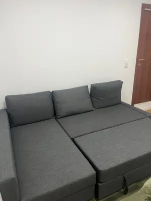a gray couch in a living room at Martiapartamento in Hospitalet de Llobregat