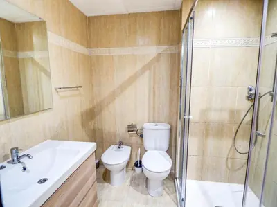 a bathroom with a toilet and a sink and a shower at Bambino apartment by Hello Homes Sitges in Sitges