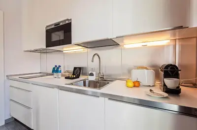 a kitchen with a sink and a counter top at Sweett - Atic Gracia in Barcelona
