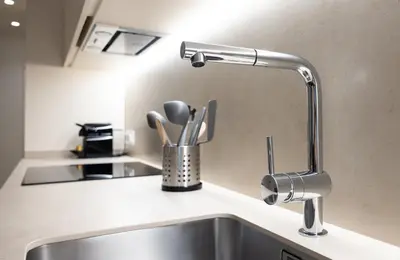 a kitchen sink with a faucet on a counter at Stay U-nique Apartment Astúries in Barcelona