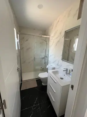a bathroom with a shower and a toilet and a sink at Maison de Rêve avec Piscine Privative et Vue sur Mer - Proche Barcelone et Port Aventura in Cunit