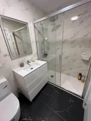 a bathroom with a shower and a sink and a toilet at Maison de Rêve avec Piscine Privative et Vue sur Mer - Proche Barcelone et Port Aventura in Cunit