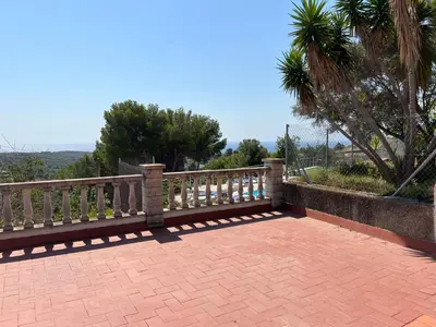 a bench sitting on top of a brick patio at Maison de Rêve avec Piscine Privative et Vue sur Mer - Proche Barcelone et Port Aventura in Cunit