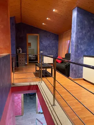 a view of a living room from the second floor of a house at DUPLEX LUMINOSO Y TRANQUILo in El Pont de Vilomara