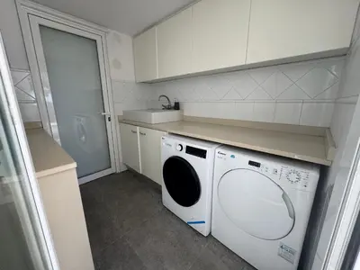 a kitchen with a washing machine in a kitchen at CASA CON JARDIN, SAUNA, PISCINA PRIVADA y NATURALEZA CERCA DE BARCELONA in Pallejá