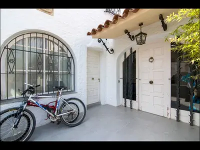 a bike parked on the side of a house at Holiday home Anexa in Masnou