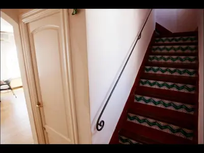 a staircase in a room next to a door at Holiday home Anexa in Masnou