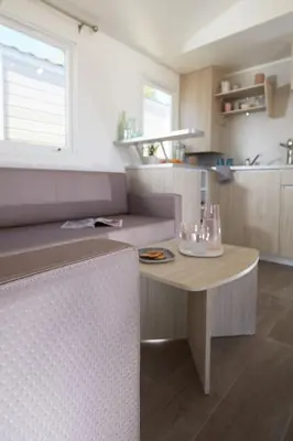 a small kitchen with a table in a room at Càmping Bellsol in Pineda de Mar