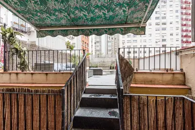 a set of stairs in a city with buildings at The Collection Barcelona - Eixample 3BD Apartment with Private Terrace in Barcelona